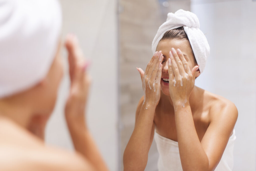 woman washing face bathroom 1024x683 - Woman washing face in bathroom -